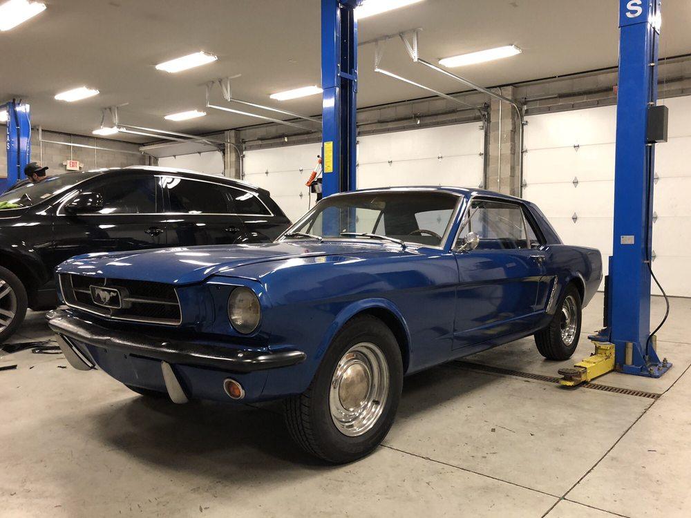 Classic blue Ford Mustang in the shop