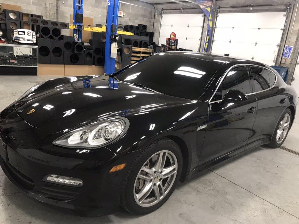 Black Porsche Panamera with tinted windows